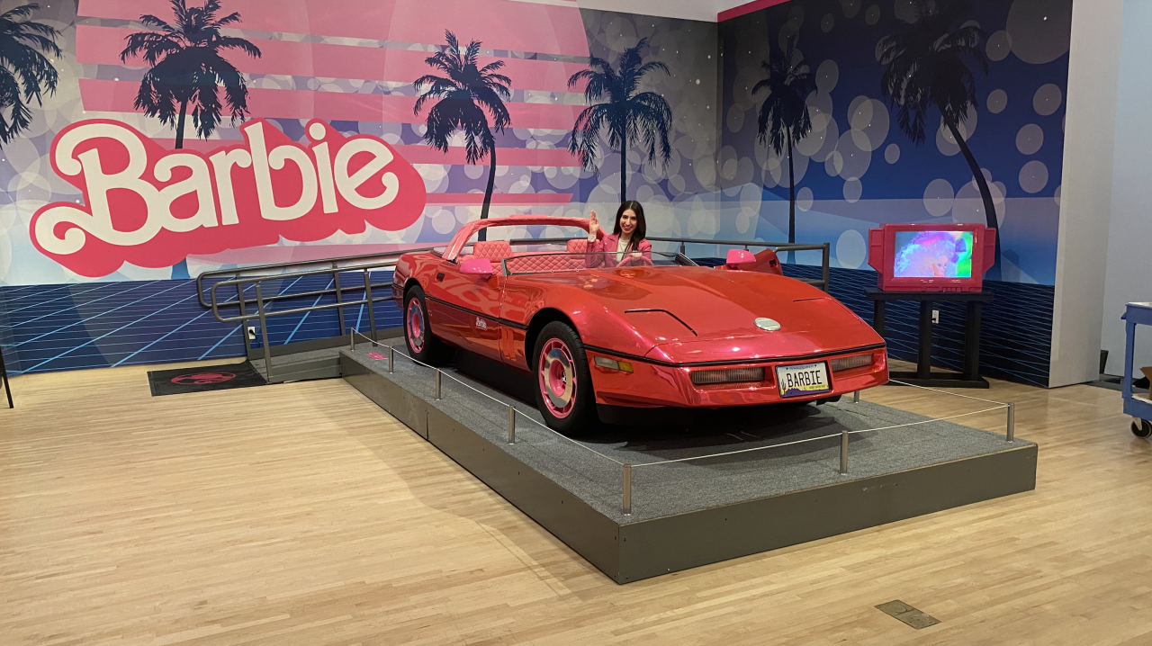 Check this out: you can get inside of the life-size Barbie Mirror-Pink Corvette at the exhibit.