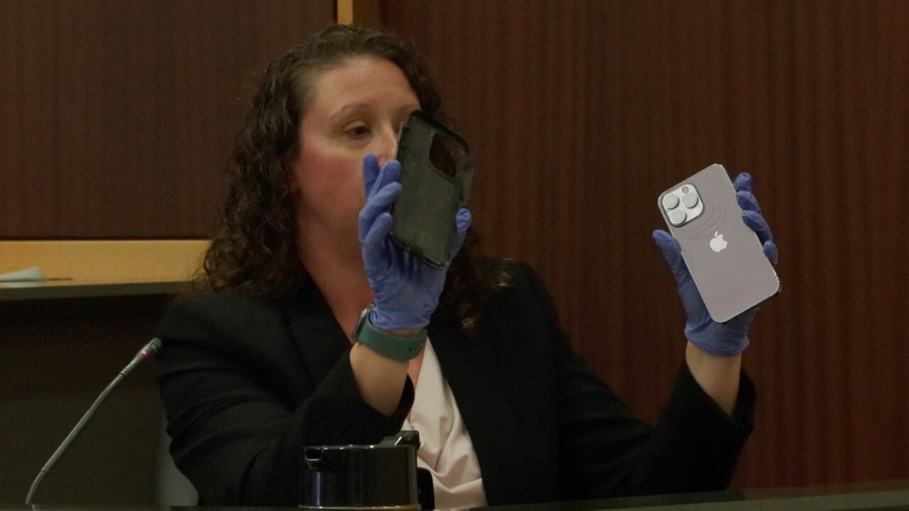 Technician explains how discarded case does not fit Davis's phone