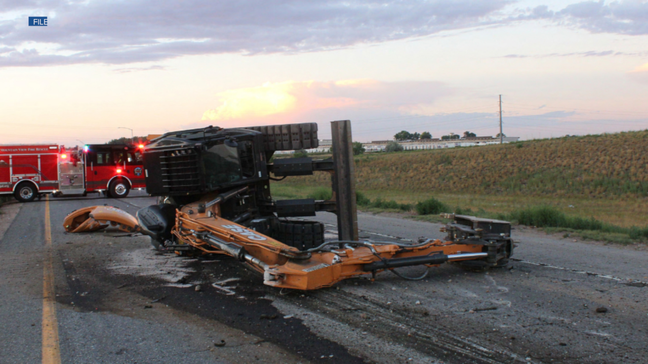 A semi-truck carrying an excavator crashed into a bridge over Interstate 25 near Mead.