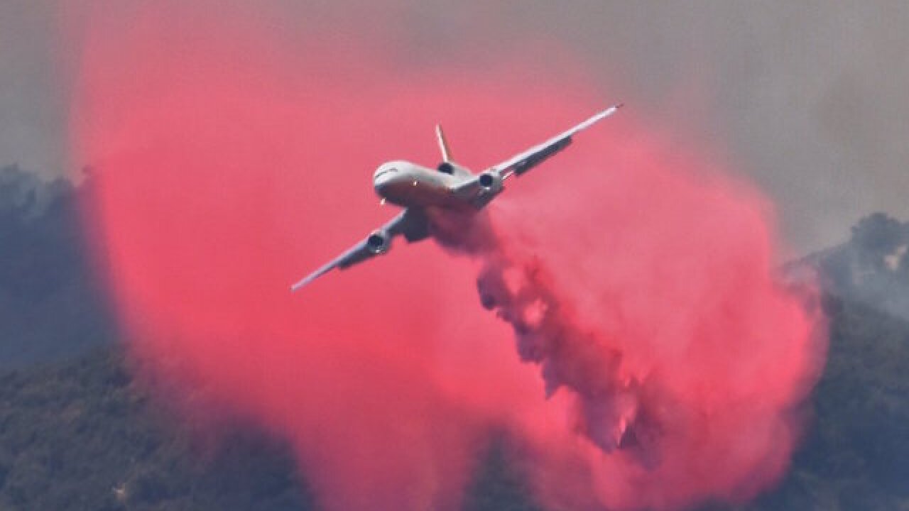 Surrounded by flames, California firefighters rescue US flag from wildfire