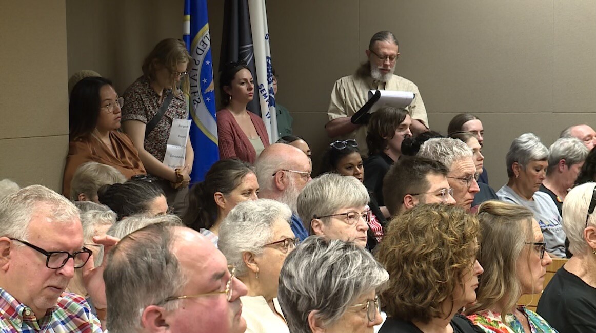 cover photo and packed courtroom.jpeg