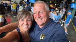 Cheryl and her husband at the American Family Field