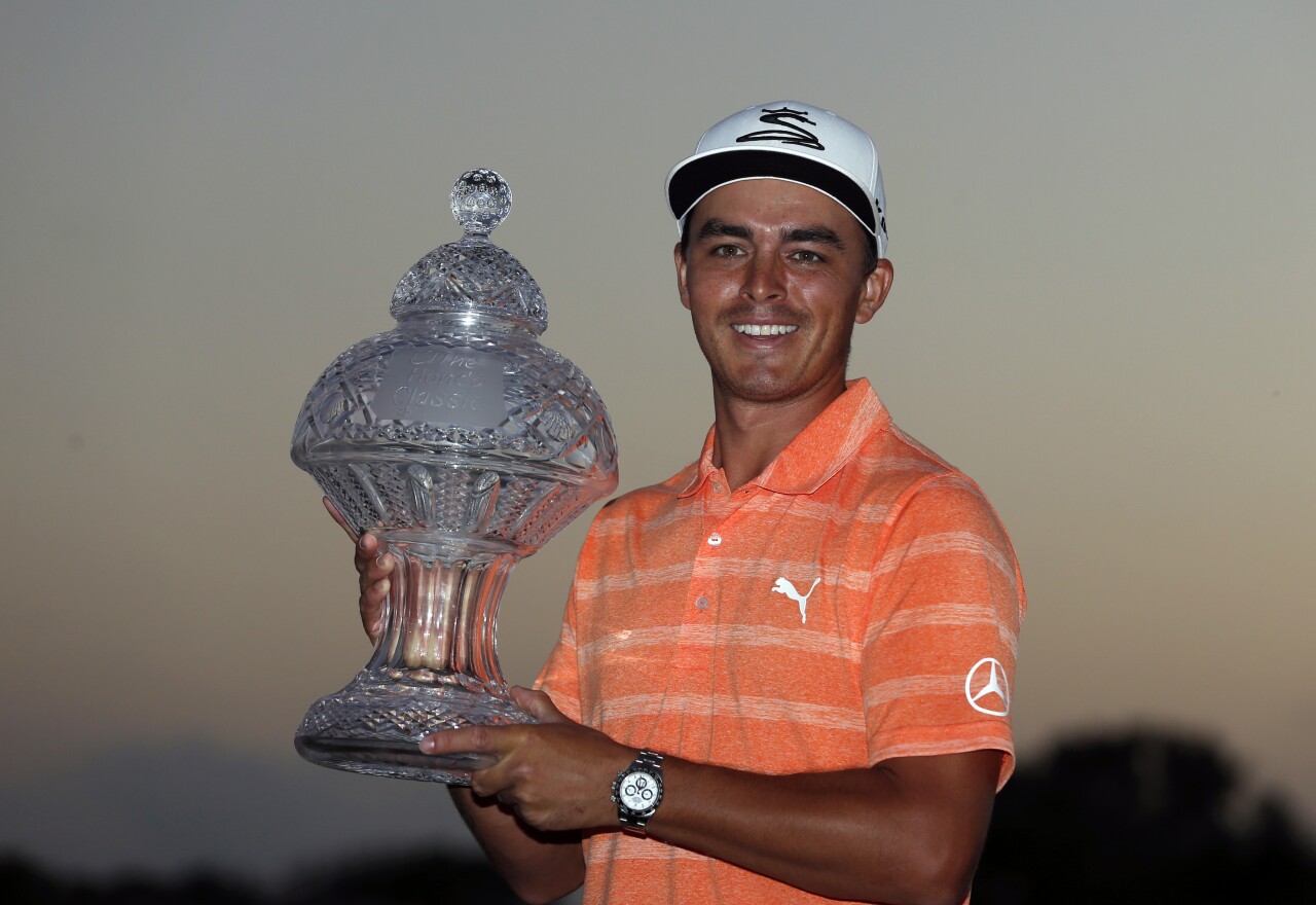 Rickie Fowler holds 2017 Honda Classic trophy