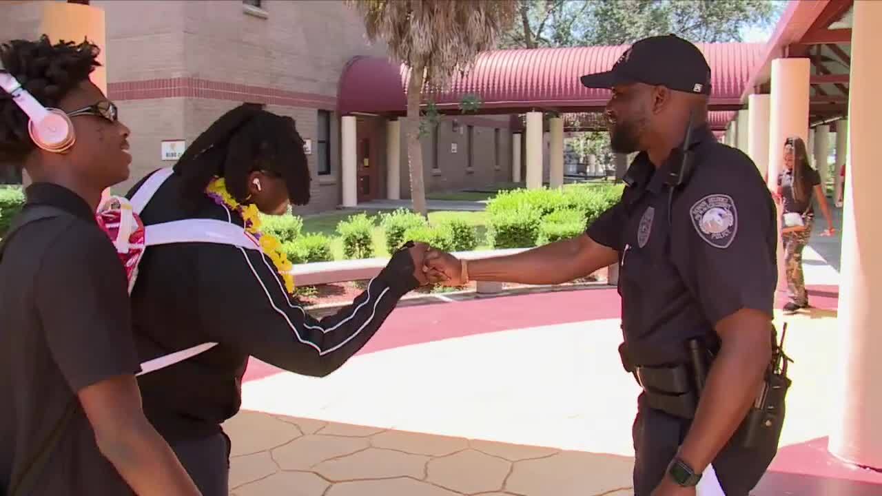 Omar Haugabook greets students at Glades Central Community High School