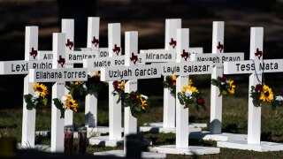Crosses with the names of Tuesday's shooting victims are placed outside Robb Elementary School in Uvalde, Texas, Thursday, May 26, 2022.