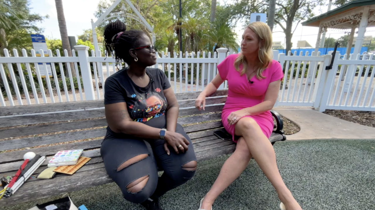 Janie Desir speaks with WPTV morning anchor Ashley Glass at a "Let's Hear It" event in Vero Beach.