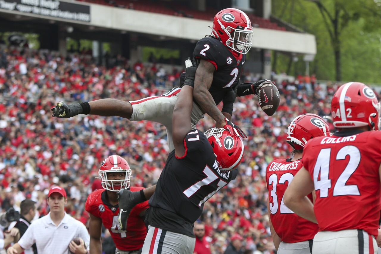 Georgia Bulldogs running back Kendall Milton celebrates after touchdown with offensive lineman Devin Willock during 2022 spring game