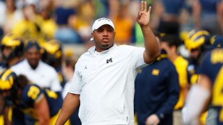 Michigan offensive coordinator Josh Gattis watches during warmups before an NCAA college football game in Ann Arbor, Mich., Saturday, Sept. 7, 2019