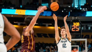 Marquette senior forward Ben Gold rises for a jump shot against a Central Michigan defender on Saturday, Nov. 22, 2025, at the Fiserv Forum in Milwaukee.