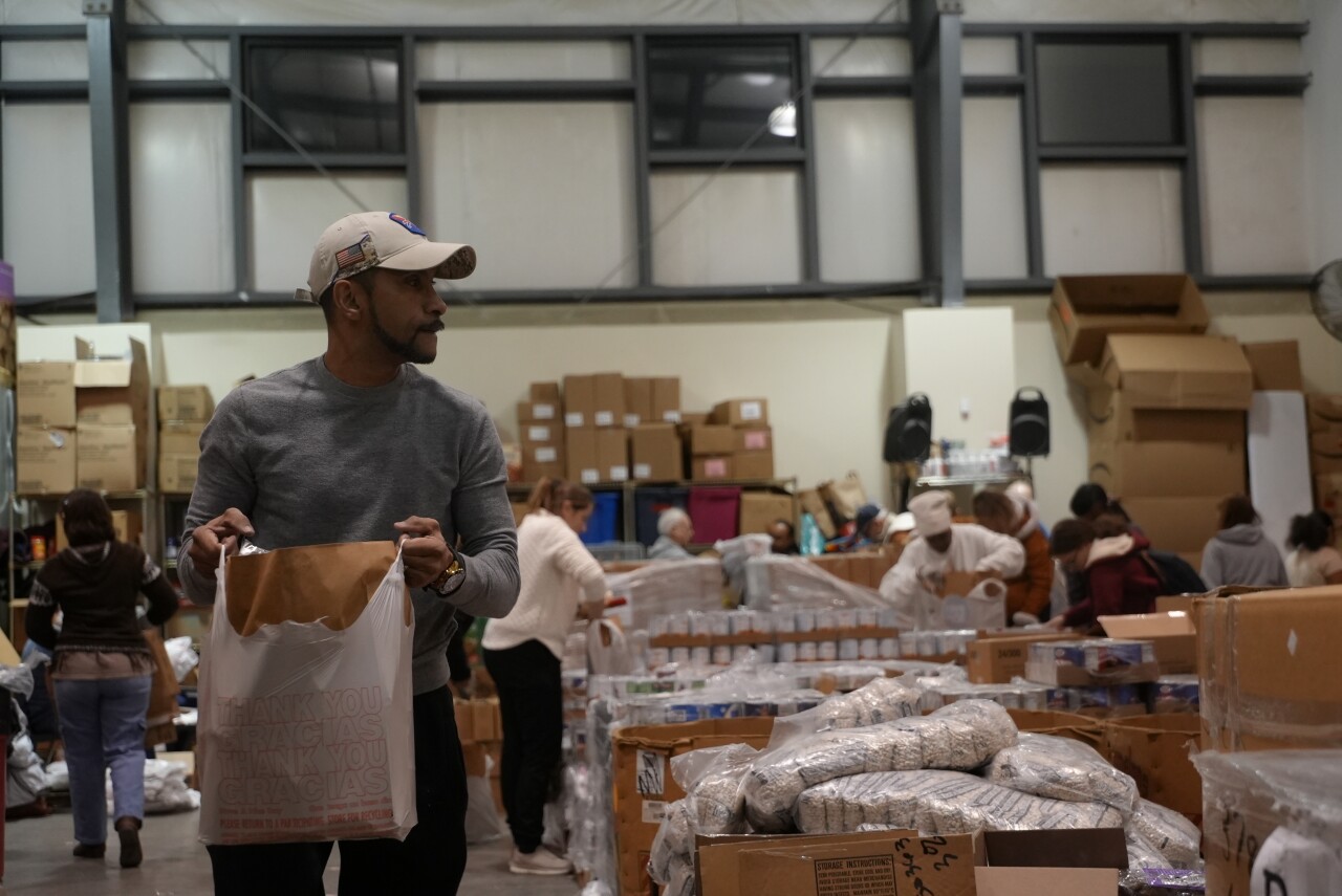 Volunteers packing groceries
