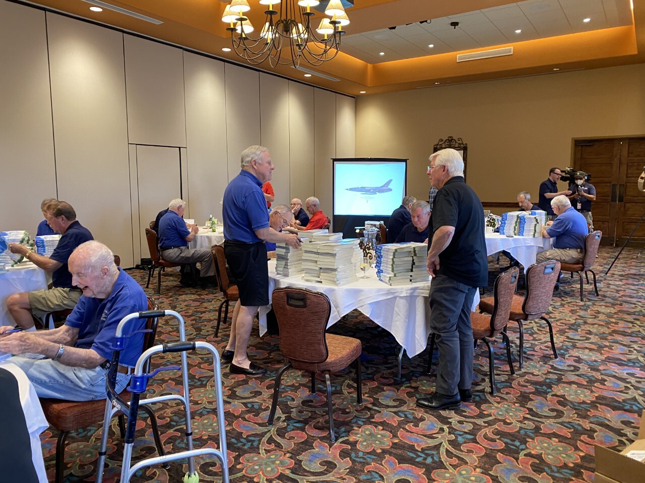 The Friday Pilots signing copies of their new book