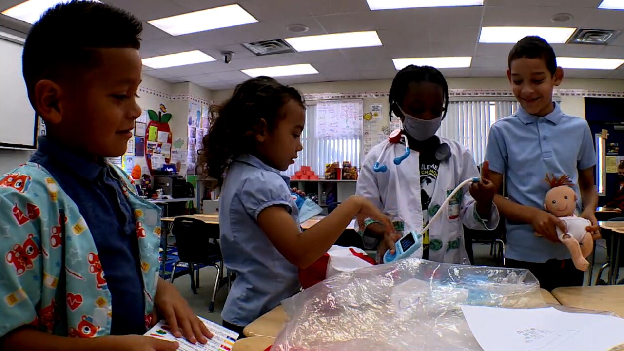 Students at White City Elementary School near Fort Pierce play with doctor sets on March 4, 2022.jpg