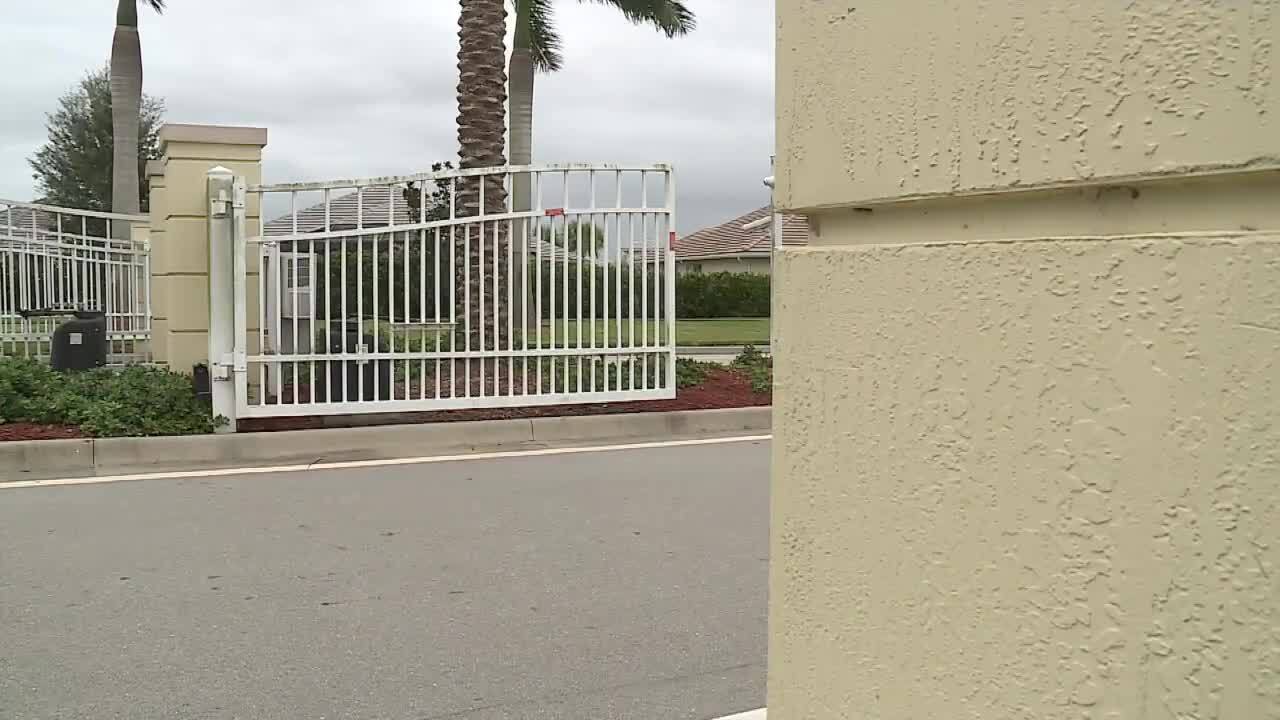 Gate to TownPark at Tradition community that police say shooter's vehicle drove onto grass to enter, Dec. 13, 2023