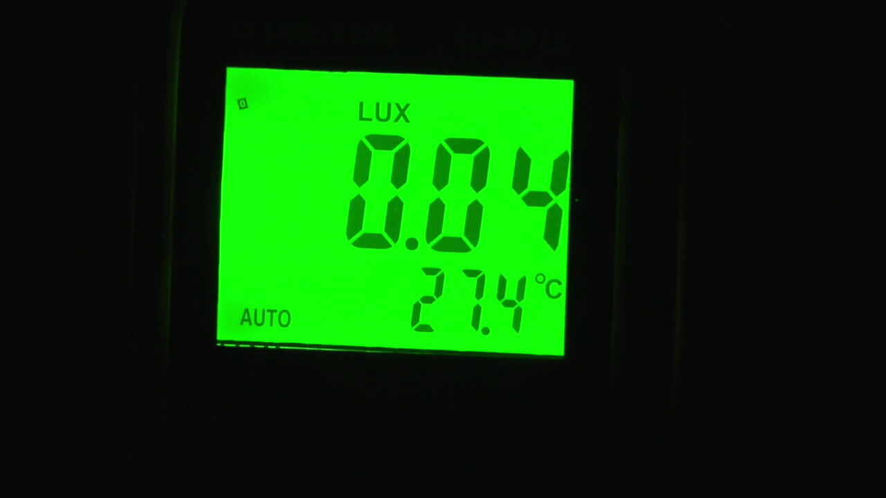 An illuminance meter registers the low light level in the parking lot at Broadway Place.