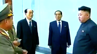 North Korean President Kim Jong-un speaks to advisers.