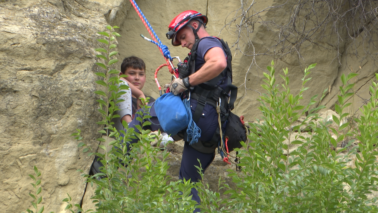 A Billings firefighter reaches Van Sloan