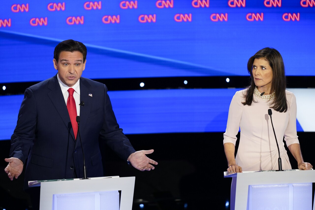 Former UN Ambassador Nikki Haley looks over towards Florida Gov. Ron DeSantis during the CNN Republican presidential debate at Drake University in Des Moines, Iowa, on Wednesday.