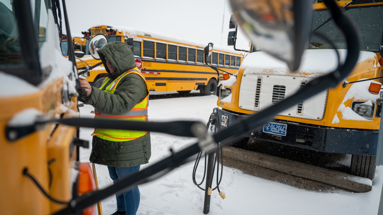Snow Day Bus Rider Bus drivers deal with the first big snow of the season