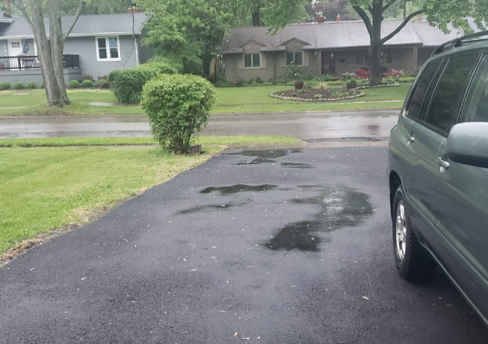 Avon Lake woman issues paving contractor advice after asphalt driveway job
