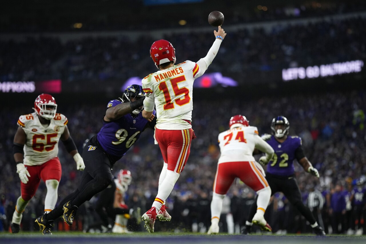 Kansas City Chiefs QB Patrick Mahomes throws under pressure from Baltimore Ravens defensive tackle Broderick Washington in second half of AFC Championship, Jan. 28, 2024