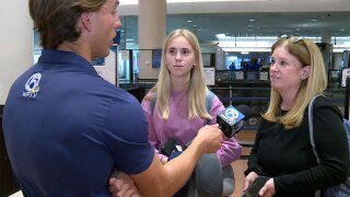 Travelers at PBIA speak to WPTV reporter Tyler Hatfield on Jan. 23, 2026.