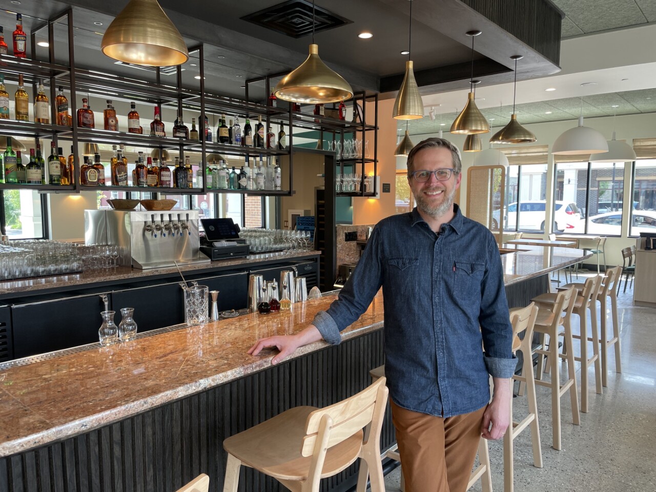 Paul Berglund standing inside his new Italian-inspired restaurant, Myrth