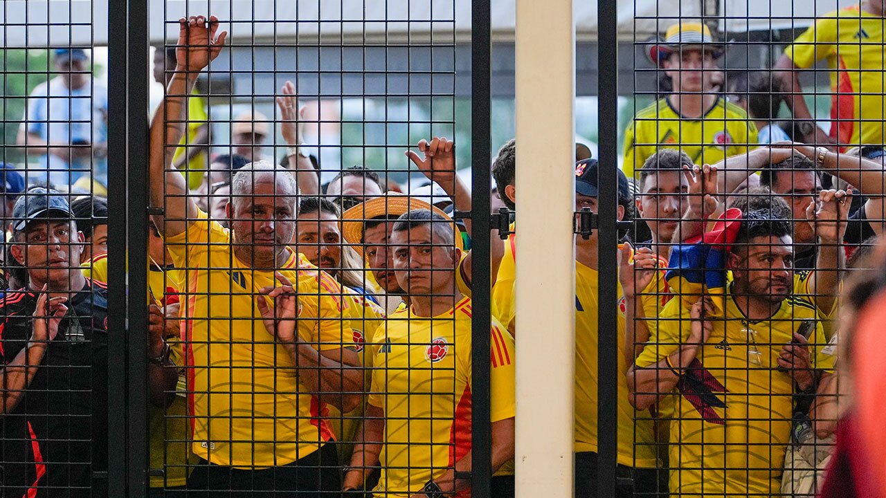 Fans wait to enter the stadium prior to the Copa America final soccer match between Argentina and Colombia in Miami Gardens, Fla., Sunday, July 14, 2024.