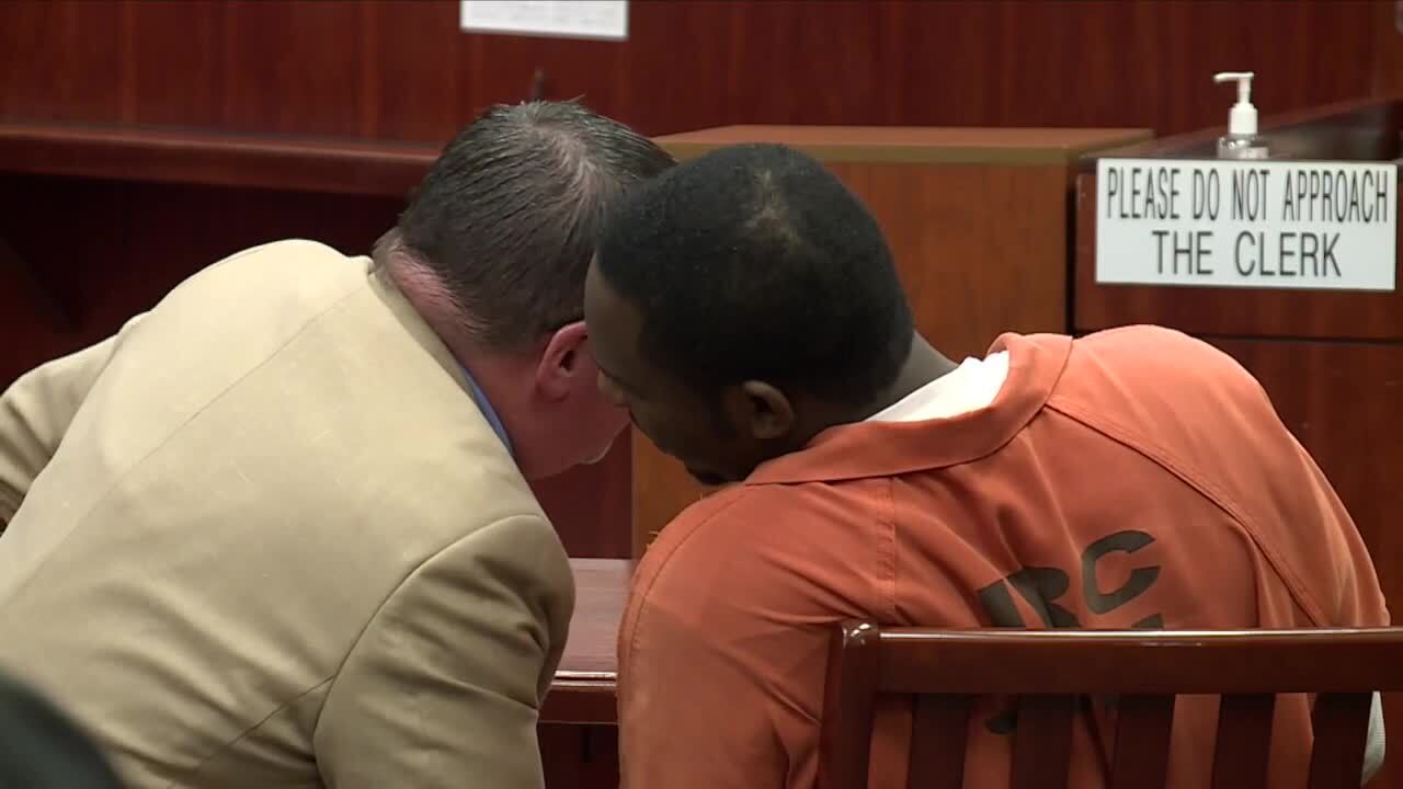 Andrew Coffee IV speaks to attorney during sentencing hearing, Feb. 14, 2022