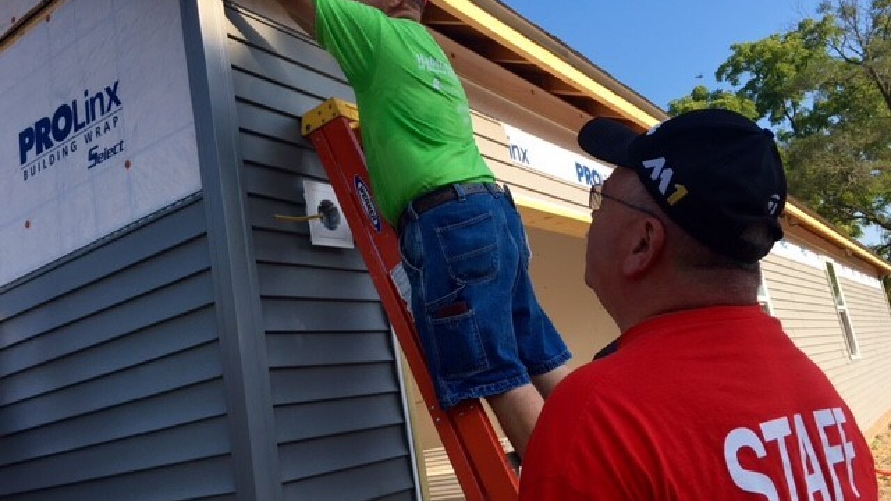 PHOTOS: Police build Habitat for Humanity home