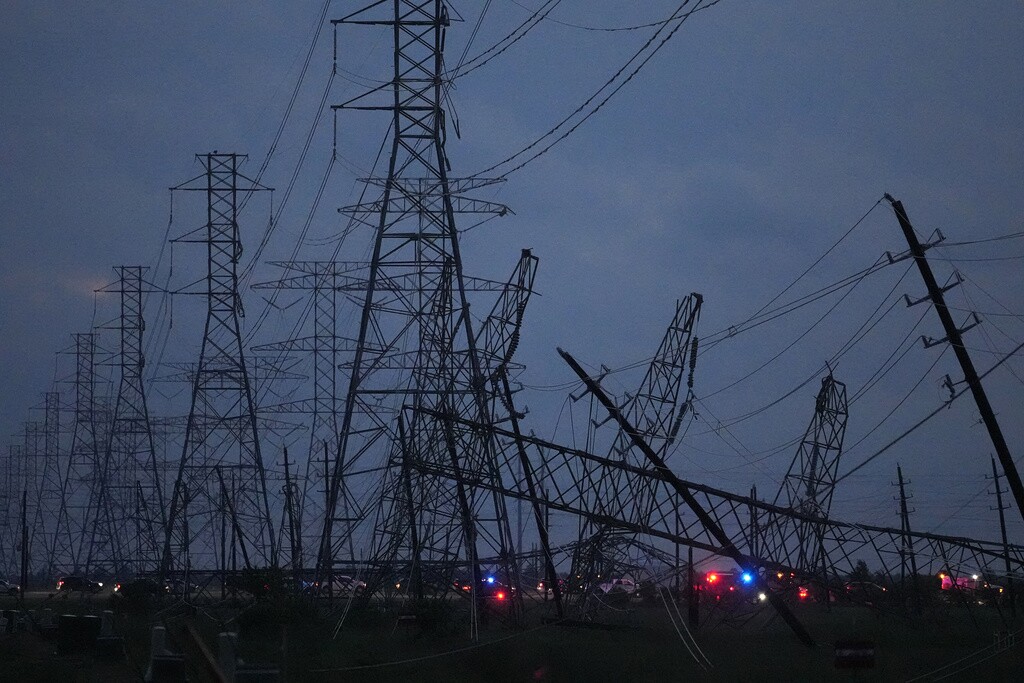 A storm brought down transmission power lines in Cypress, Texas.