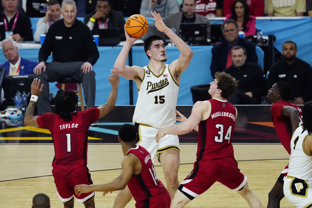 Purdue Boilermakers center Zach Edey shoots over NC State Wolfpack forward Ben Middlebrooks in Final Four, April 6, 2024