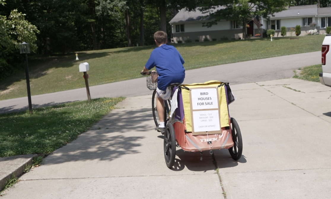 Jackson out on his bike making deliveries