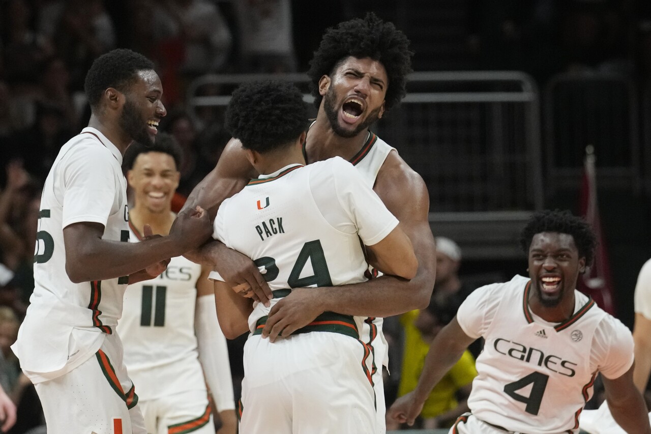Miami Hurricanes forward Norchad Omier hugs guard Nijel Pack at Virginia Tech Hokies, Jan. 31, 2023