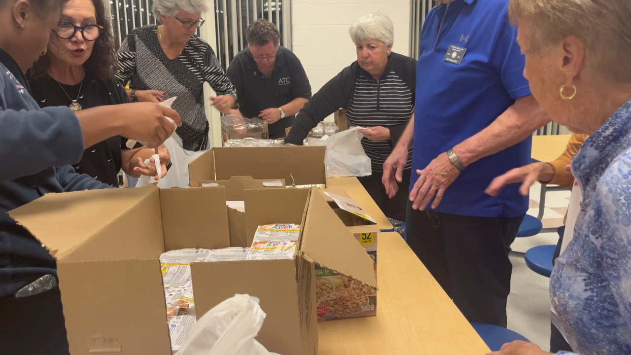 Volunteers pack food