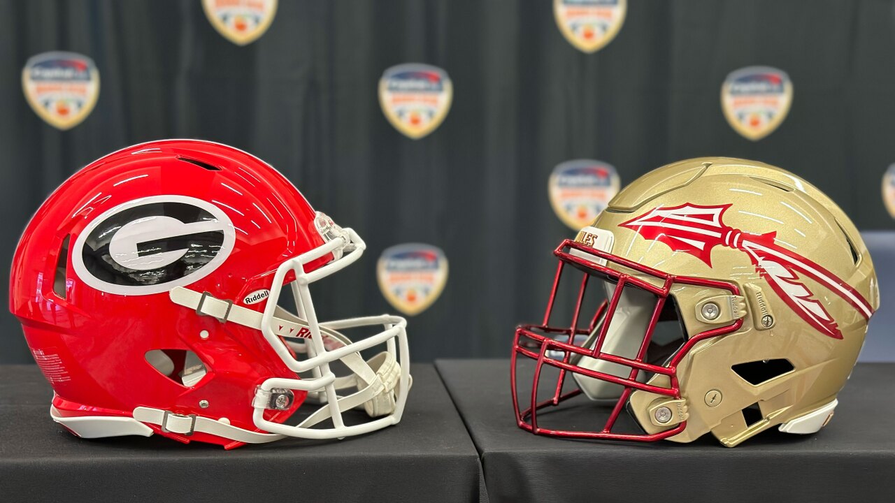 Georgia Bulldogs and Florida State Seminoles helmets on display before Orange Bowl coaches news conference, Dec. 29, 2023