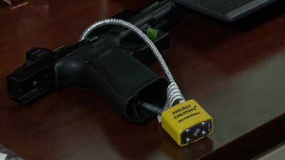 Gun with safe storage lock