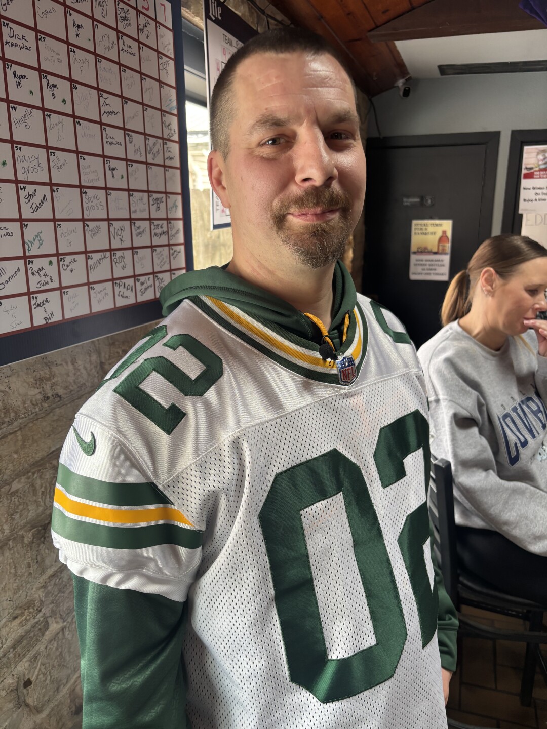 Jamie Hintz celebrates Thanksgiving with friends during the Green Bay Packer football game at Eddie's Lake House Bar in West Bend