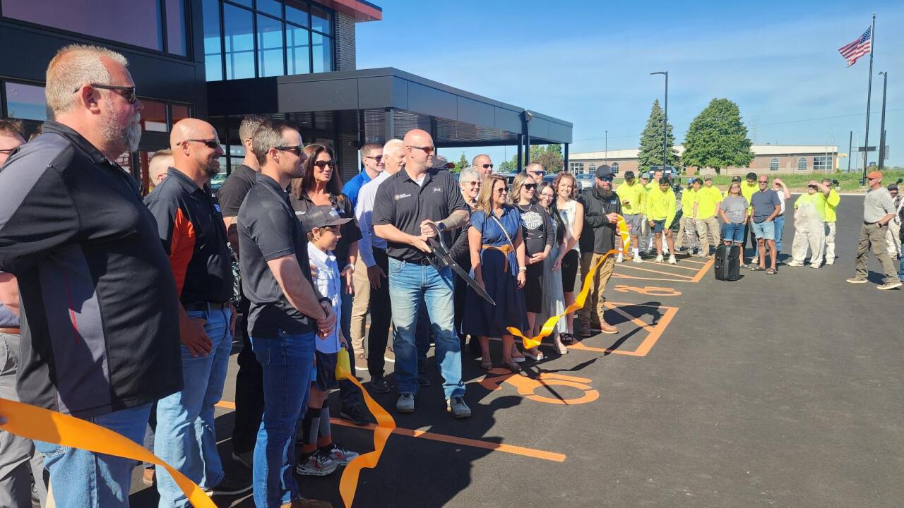 Appleton Harley Davidson employees cut the ribbon on their expanded location