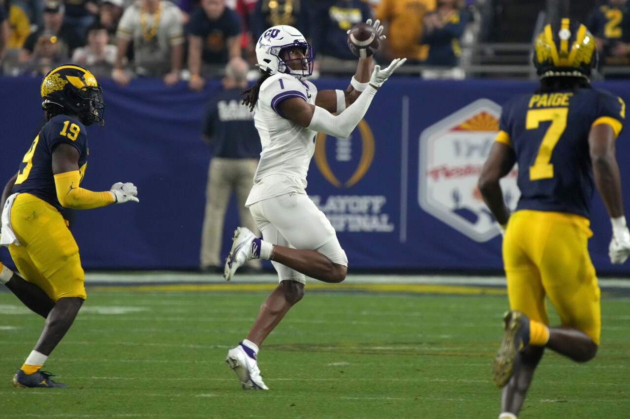 TCU Horned Frogs receiver Quentin Johnston makes catch vs. Michigan Wolverines in College Football Playoff semifinal at Fiesta Bowl, Dec. 31, 2022