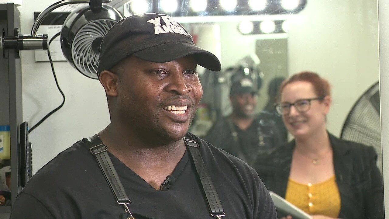 Barbershop owner Earl McNary talks to News 5 reporter Michelle Jarboe.