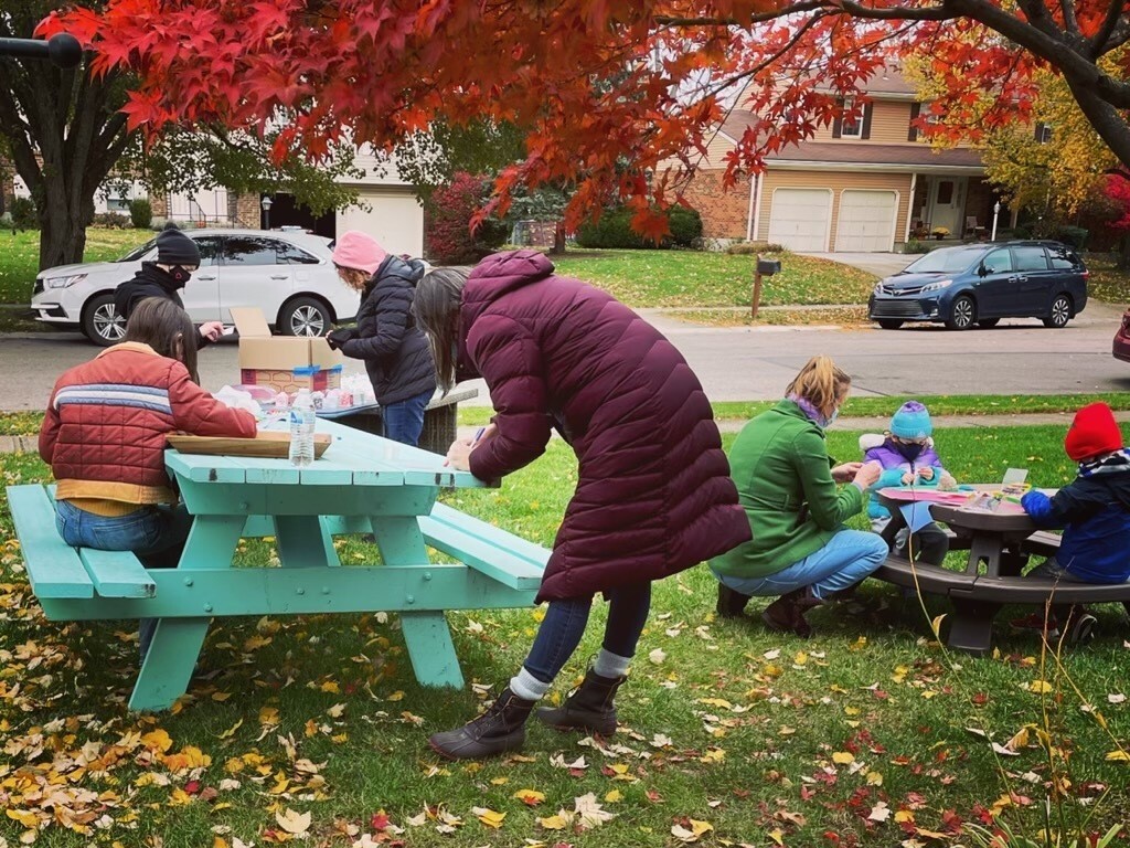 Volunteers help pack medical love drop care packages at the McClures' Blue Ash home on a Saturday in November.