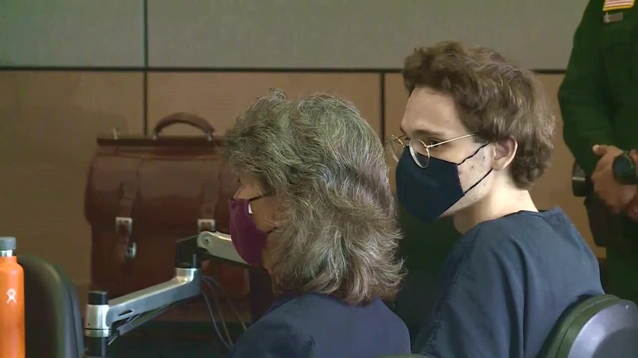 Corey Johnson looks at public defender Carey Haughwout during sentencing hearing, Jan. 13, 2022