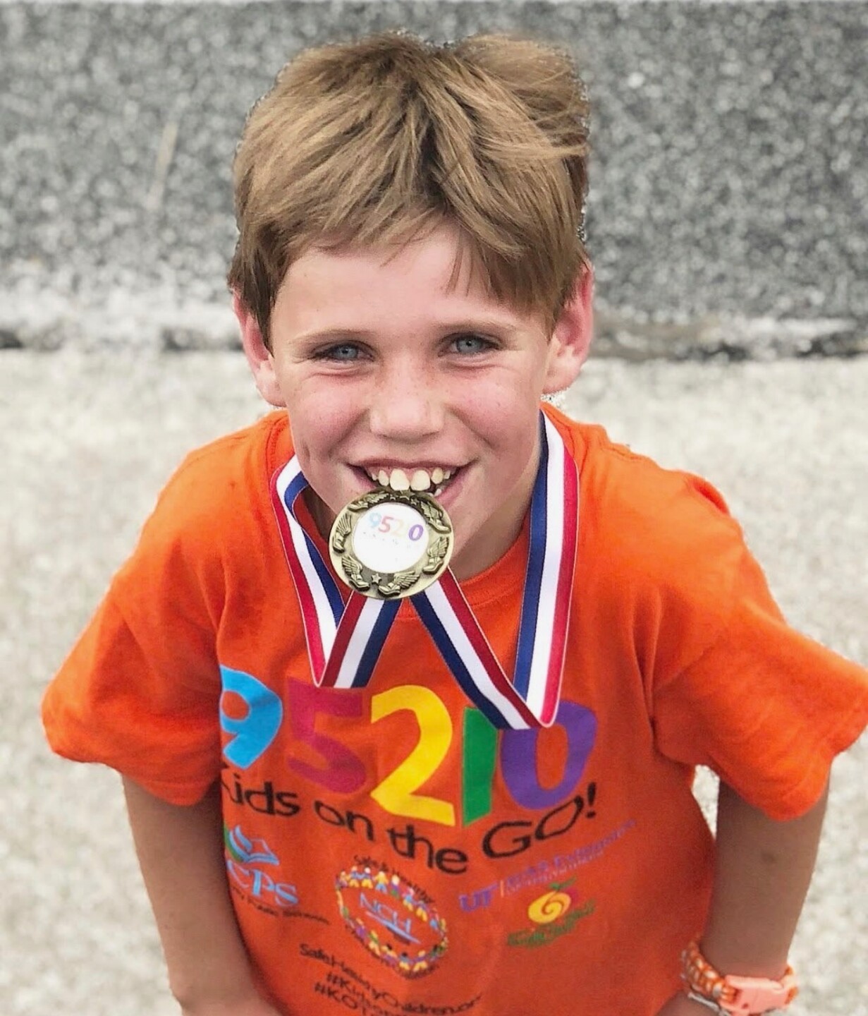 Paxton with a medal around his neck.