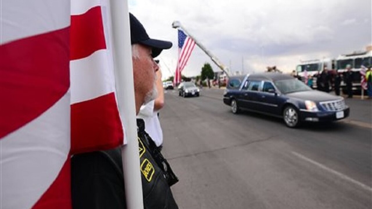 Thousands honor slain New Mexico police officer at funeral