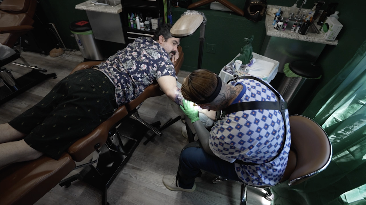 Ryane Rose Tattoing Overhead.png