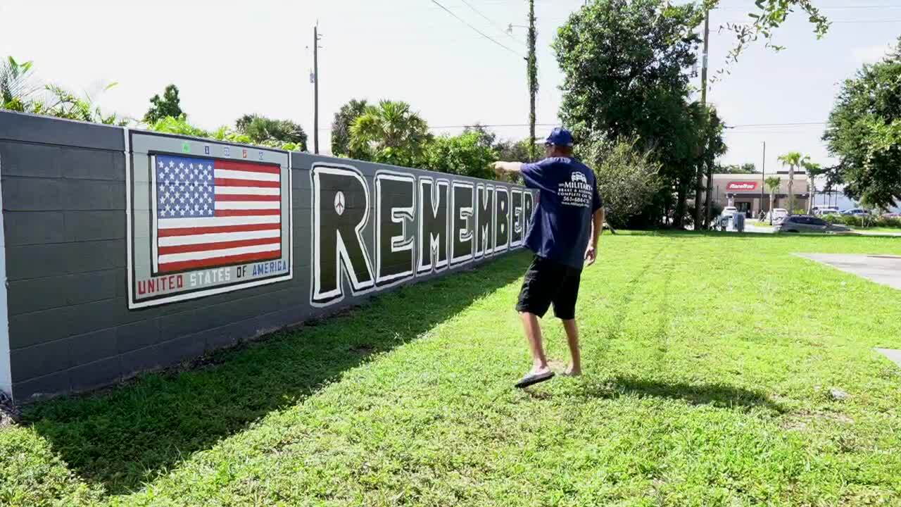 Matt Verlander points at 9/11 wall mural