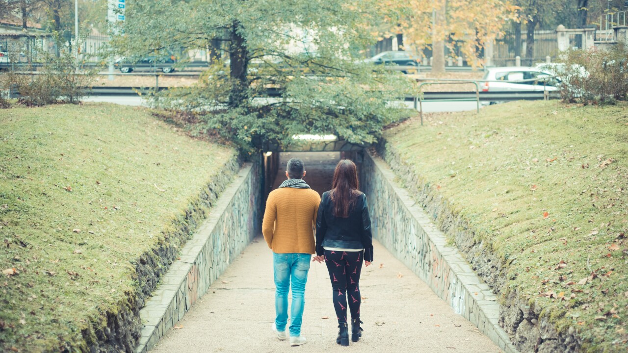 young couple in the park during autumn season outdoor