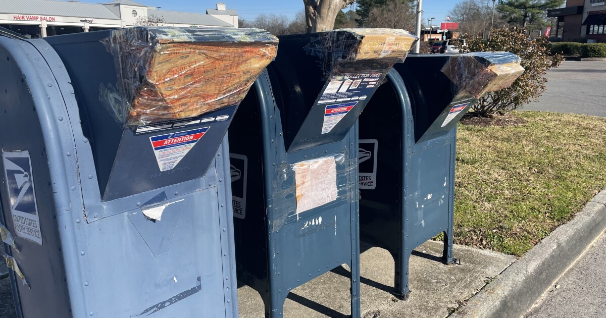 USPS collection bins taped across Hampton Roads