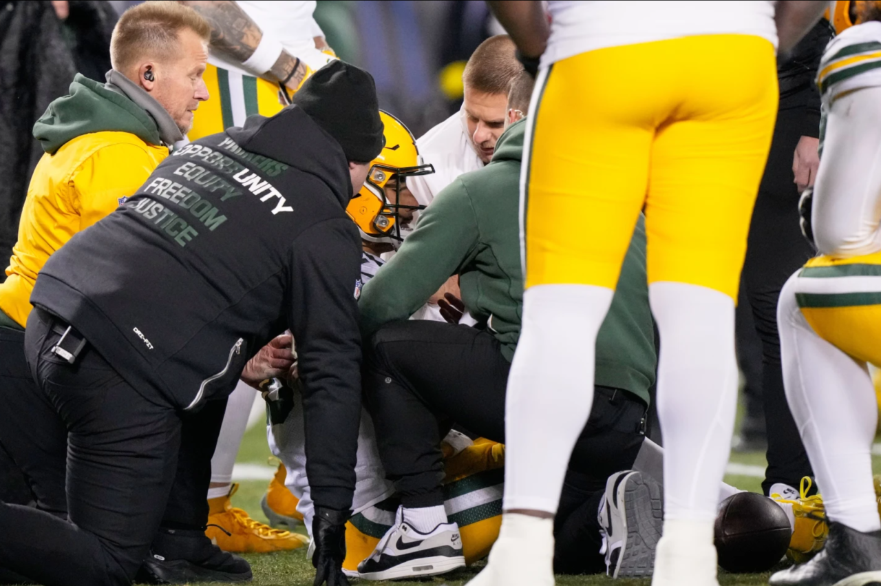 Green Bay Packers' Jordan Love is attended to after being hurt during the first half of an NFL football game against the Chicago Bears Saturday, Dec. 20, 2025, in Chicago, Ill.