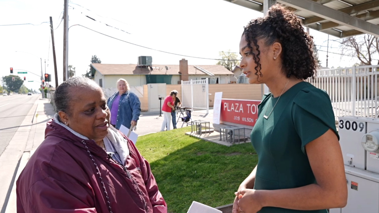 Dominique interviewing another concerned resident, Freda Banks